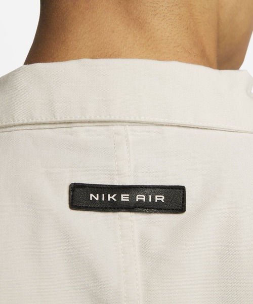 NIKE（ナイキ）の「ナイキ スポーツウェア エア メンズ ウーブン オーバーシャツ トップ / Nike Sportswear Air