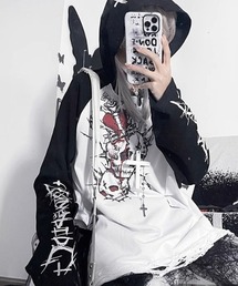 NOVESSEL（ノベセル）の「A'GEM/9 × .kom『TricuspidC/トライカスピッドシー』フード付きスカルプリントロングスリーブTシャツ（Tシャツ/カットソー）」