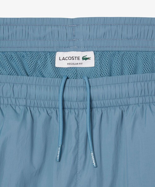 LACOSTE（ラコステ）の「ワッシャー加工 ナイロン 軽量撥水トラックパンツ（その他パンツ・メンズ・グレイッシュブルー/ブラック・3/2/5/4）」の10枚目の写真
