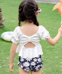 TeddyShop（テディショップ）の「【キッズ水着/裏地付き】半袖 バック リボン カットアウト パフスリーブ リブ ペプラムトップス+フリルショーツ+スイムキャップ 上下3点セット（水着）」