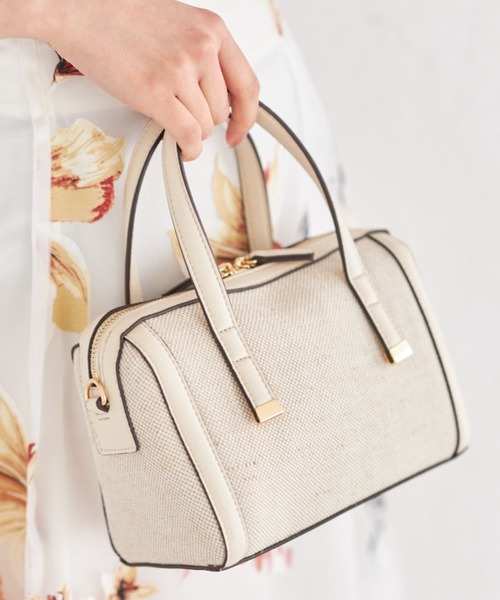 tocco closet(トッコ クローゼット)の「2WAYショルダー付き異素材バッグ(ボストンバッグ・レディース・アイボリー/ブラック・FREE)」の1枚目の写真