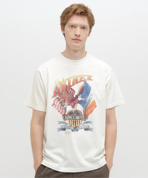 AVIREX(アヴィレックス)の「《直営店限定》FADE S/S T-SHIRT ”EAGLE” / フェード 半袖Tシャツ ”鷲” / AVIREX / アヴィレックス(Tシャツ/カットソー・メンズ・ホワイト系2/チャコールグレー/オレンジ・XL/L/M/2XL)」の2枚目の写真