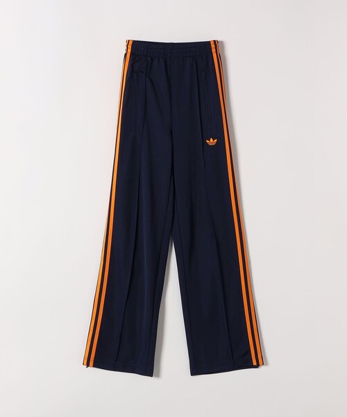 adidas(アディダス)の「adidas:〈洗濯機可能〉アディカラー クラシック ファイヤーバード ルーズ トラック パンツ(その他パンツ・レディース・ネイビー・X-SMALL)」の1枚目の写真