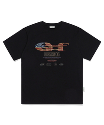 ESCAPEFROM（エスケープフロム）の「ヴィンテージフラッグ ESCFロゴコラージュプリントオーバーサイズ半袖Tシャツブラック（Tシャツ/カットソー）」