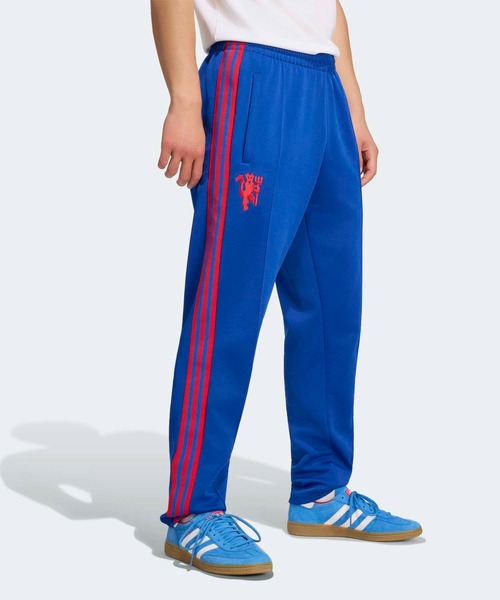 adidas(アディダス)の「マンチェスター・ユナイテッド オリジナルス トラックパンツ / アディダス adidas(その他パンツ・メンズ・ブルー・XX-LARGE/XXX-LARGE/LARGE/MEDIUM/SMALL/X-LARGE)」の1枚目の写真