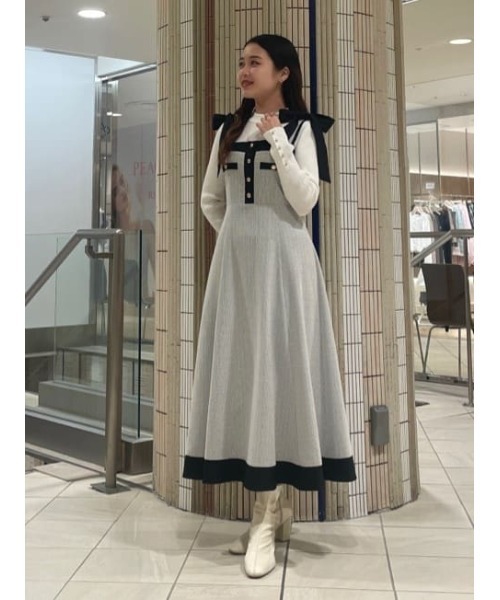 AND COUTURE(アンドクチュール)の「袖ボタンハイネックリブプルオーバー(ニット/セーター・レディース・オフホワイト/ブラック/ラベンダー/オレンジ・FREE)」の8枚目の写真
