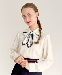 an another angelus（アンアナザーアンジェラス）の「ロゴスカーフリボン付きシャツ（シャツ/ブラウス）」