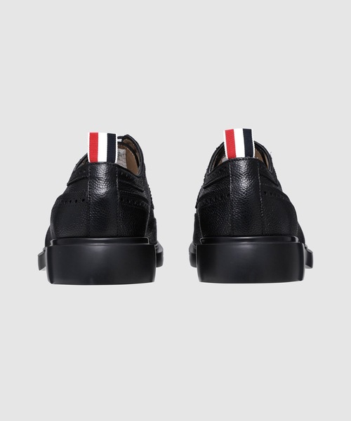 THOM BROWNE（トムブラウン）の「LONGWING BROGUE W/ LIGHTWEIGHT RUBBER SOLE IN PEBBLE GRAIN（ローファー・メンズ・ブラック・9.5/9）」の4枚目の写真