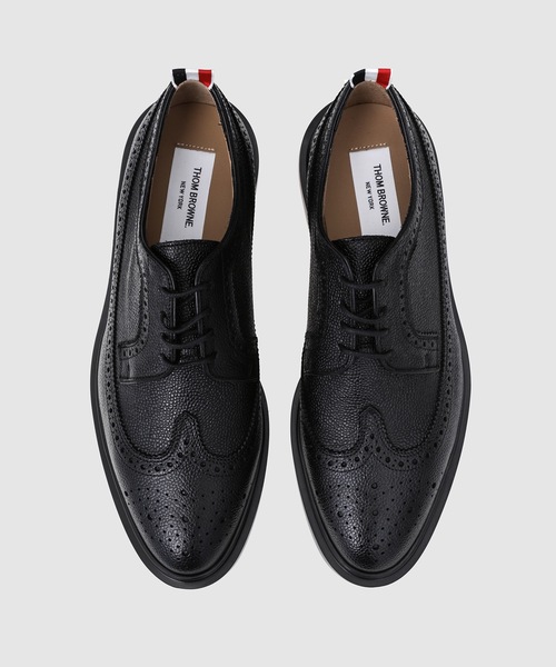THOM BROWNE（トムブラウン）の「LONGWING BROGUE W/ LIGHTWEIGHT RUBBER SOLE IN PEBBLE GRAIN（ローファー・メンズ・ブラック・9.5/9）」の5枚目の写真