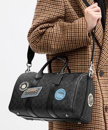 COACH（コーチ）の「コンパス バッグ 35・ステッカー・シグネチャー アップクラフトレザー（ドラムバッグ）」