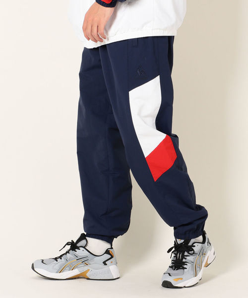 le coq sportif(ルコックスポルティフ)の「SHIPS any×le coq sportif: 別注 トラックパンツ(その他パンツ・メンズ・ブラック/ネイビー・SMALL/MEDIUM/LARGE)」の1枚目の写真