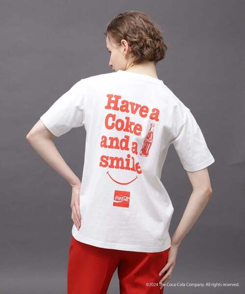 AVIREX（アヴィレックス）の「AVIREX / Coca-Cola 80'S SMILE T-SHIRT