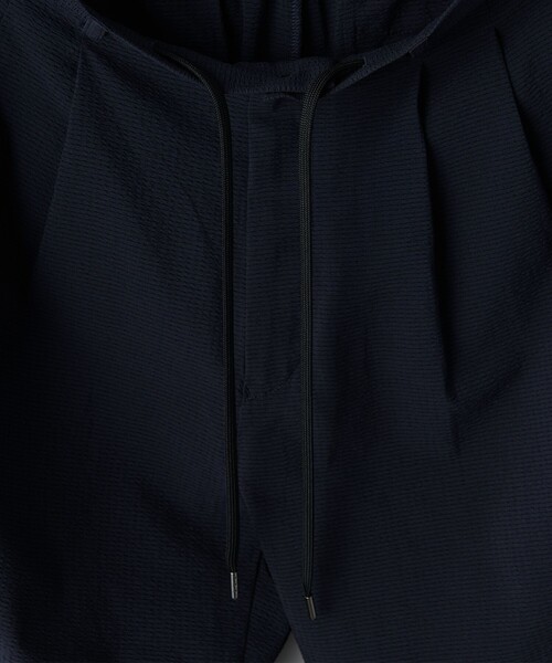 UNITED ARROWS(ユナイテッドアローズ)の「DotAir ドットエア サッカー ヘムコード 2プリーツパンツ -吸水速乾・ストレッチ-(その他パンツ・メンズ・ネイビー/ブラック・L/M/S)」の19枚目の写真