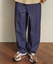 COMONINOZ（コモニノズ）の「BUTTON TUCK PANTS [INDIGO BLUE]（その他パンツ）」