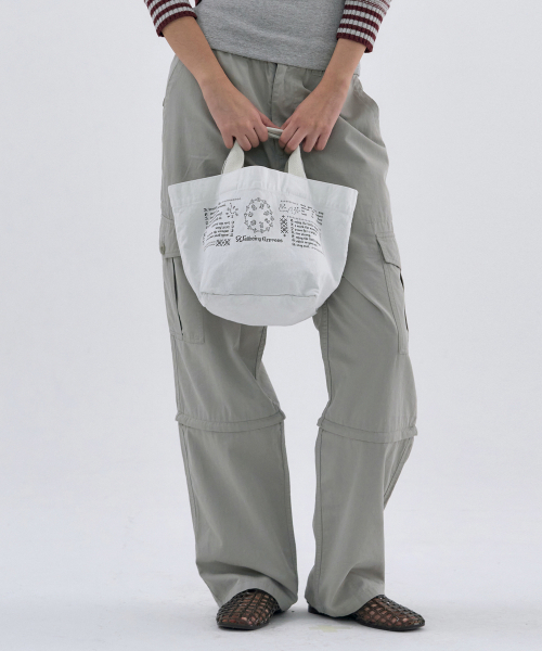 WELLBEING EXPRESS(ウェルビーイングエクスプレス)の「Message Mini Eco Bag White(エコバッグ/サブバッグ・レディース・その他・OS)」の1枚目の写真