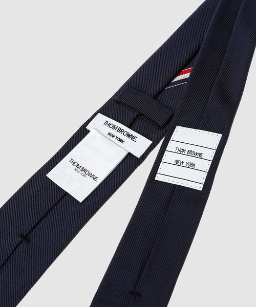 THOM BROWNE(トムブラウン)の「CLASSIC TIE IN ENGINEERED RWB GEM HECTOR TIE JACQUARD(ネクタイ・メンズ・ネイビー・ONE SIZE)」の3枚目の写真