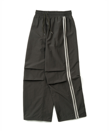 EXCONTAINER（エックスコンテナ）の「サイドラインナイロントラックパンツ（ディープカーキ）（スウェットパンツ）」
