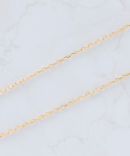 NOIR DE POUPEE（ノワールドプーペ）の「K18 YG×WG 3粒