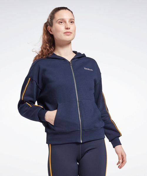 Reebok（リーボック）の「パイピング ジップアップ フーディー / Piping Zip-Up Hoodie（パーカー・レディース・ブラック/ネイビー/グレイッシュブルー・SMALL/MEDIUM/LARGE/X-LARGE/X-SMALL/XX-LARGE）」の3枚目の写真