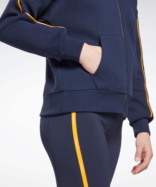 Reebok（リーボック）の「パイピング ジップアップ フーディー / Piping Zip-Up Hoodie（パーカー・レディース・ブラック/ネイビー/グレイッシュブルー・SMALL/MEDIUM/LARGE/X-LARGE/X-SMALL/XX-LARGE）」の5枚目の写真