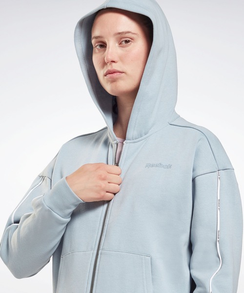 Reebok（リーボック）の「パイピング ジップアップ フーディー / Piping Zip-Up Hoodie（パーカー・レディース・ブラック/ネイビー/グレイッシュブルー・SMALL/MEDIUM/LARGE/X-LARGE/X-SMALL/XX-LARGE）」の14枚目の写真