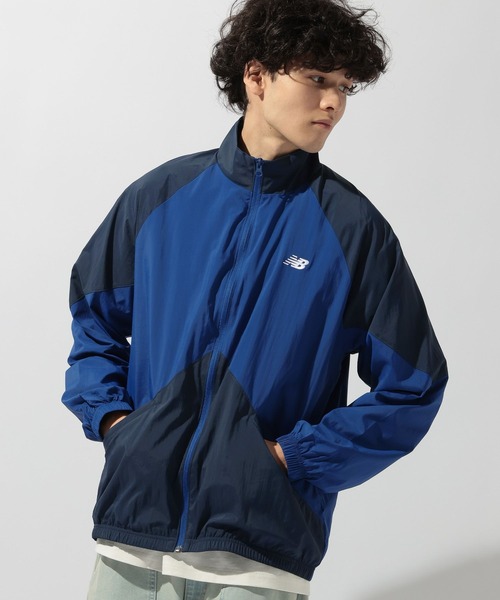 NEW BALANCE(ニューバランス)の「【New Balance(ニューバランス)】スポーツレガシージャケット(ナイロンジャケット・メンズ・ネイビー/グレー・LARGE)」の1枚目の写真