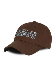 ROCKCAKE（ロックケーキ）の「Moderns Logo Ball Cap - Brown（キャップ）」