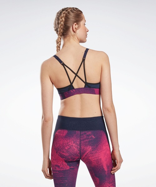 Reebok(リーボック)の「Lux ストラッピー スポーツブラ / Lux Strappy Sports Bra(スポーツブラ・レディース・マジェンタ/ブラック・SMALL/MEDIUM/LARGE/X-LARGE/XX-LARGE/X-SMALL)」の5枚目の写真