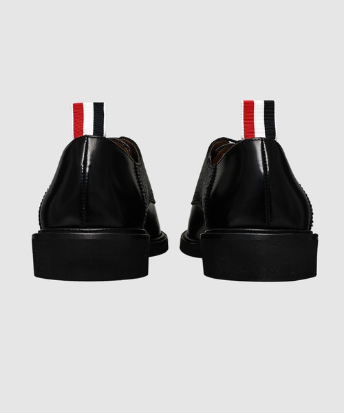 THOM BROWNE(トムブラウン)の「SADDLE SHOE W/ MICRO SOLE IN SOFT SPAZZOLATO W/ PEBBLE GRAIN LEATHER(その他シューズ・メンズ・ブラック・8.5/9/9.5)」の4枚目の写真