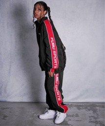 FUBU（ フブ）の「FUBU フブ ブランド ロゴ 刺繍 配色 サイドライン ウエストゴム ひも付き アメカジ イージーパンツ ナイロンパンツ トラックパンツ ジャージ（その他パンツ）」