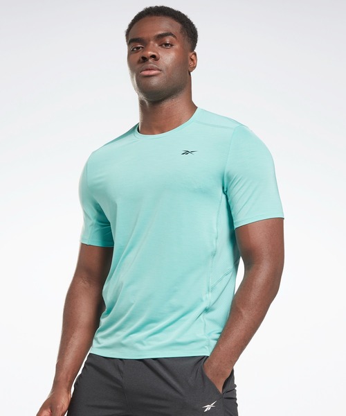 Reebok(リーボック)の「アクティブチル アスリート Tシャツ / Activchill Athlete T-Shirt(Tシャツ/カットソー・メンズ・ブラック/グレー/ターコイズブルー/ブルー・XX-LARGE/XXX-LARGE/X-SMALL/LARGE/X-LARGE/MEDIUM/SMALL/J/S/J/XO/J/L/J/M/J/O)」の1枚目の写真