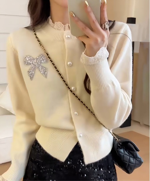 gossip!ロサンゼルス(ゴシップロサンゼルス)の「Y2K レースフリルヘムグリッターリボンニットカーデ(ニット/セーター・レディース・ワイン/ベージュ・M)」の1枚目の写真