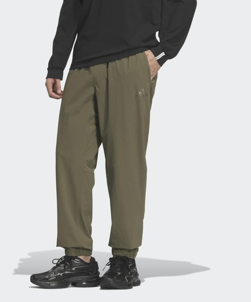 adidas(アディダス)の「エッセンシャルプラス レギュラーフィット ストレッチ ウーブン フルレングス ジョガー パンツ / アディダス adidas(その他パンツ・メンズ・カーキ・XX-LARGE/SMALL/MEDIUM/LARGE/3XL/X-SMALL/X-LARGE)」の1枚目の写真