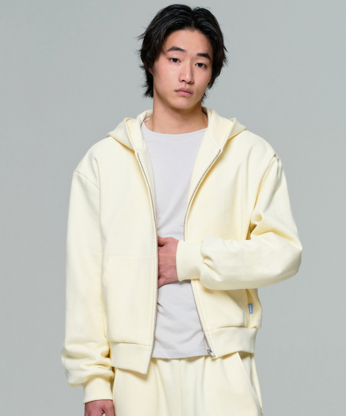 ERA（エラ）の「UNISEX ERA OVERSIZED HOODED ZIP-UP - LEMON CREAM（パーカー・レディース・クリーム・LARGE/MEDIUM/SMALL）」の13枚目の写真