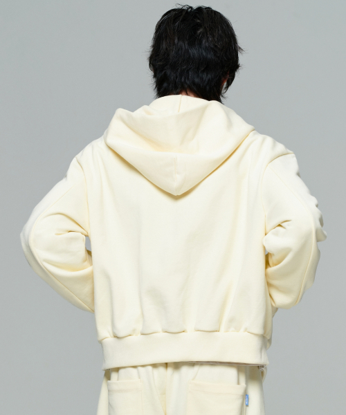 ERA（エラ）の「UNISEX ERA OVERSIZED HOODED ZIP-UP - LEMON CREAM（パーカー・レディース・クリーム・LARGE/MEDIUM/SMALL）」の11枚目の写真