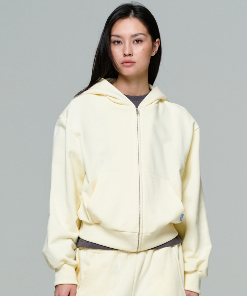 ERA（エラ）の「UNISEX ERA OVERSIZED HOODED ZIP-UP - LEMON CREAM（パーカー・レディース・クリーム・LARGE/MEDIUM/SMALL）」の8枚目の写真