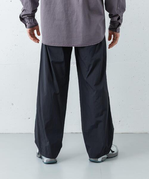 ANOTHER OFFICE(アナザー オフィス)の「ANOTHER OFFICE FLOW BANDING EASY PANTS(その他パンツ・メンズ・ブラック・3/2)」の6枚目の写真
