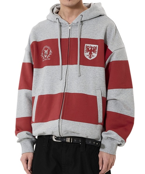 OY(オーワイ)の「『OY/オーワイ』STRIPE EMBLEM HOODIE ZIP UP/ボーダーエンブレムジップアップパーカー(パーカー・レディース・グレー/ネイビー・L/M)」の2枚目の写真