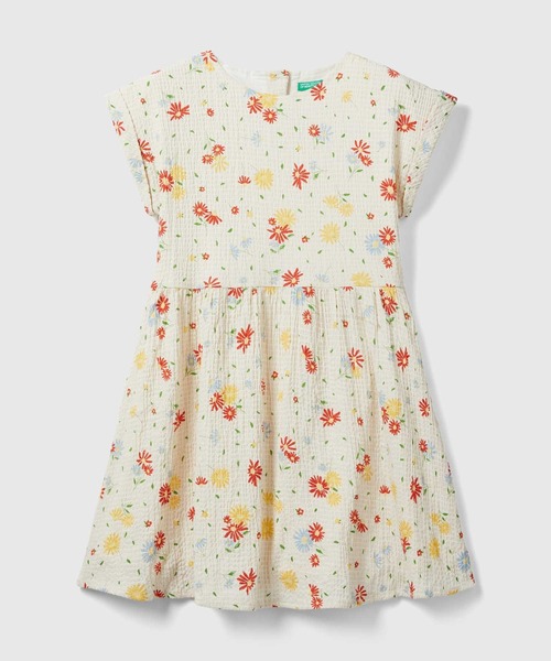 BENETTON (UNITED COLORS OF BENETTON)(ベネトンユナイテッドカラーズオブベネトン)の「キッズ花柄総柄クレポンバックボタンノースリーブワンピースG(ワンピース・キッズ・アイボリー・SMALL/MEDIUM/LARGE/X-LARGE)」の1枚目の写真