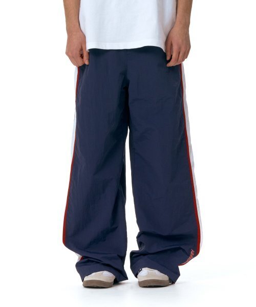 AMESWORLDWIDE（アメスワールドワイド）の「SIDE LINE TRACK PANTS NAVY (AM2ESUPA10A)（スウェットパンツ・レディース・その他・M/L）」の2枚目の写真