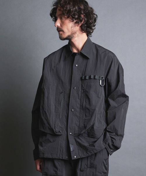 COMMON WARE(コモンウェアー)の「EM:NoiR ノアール Connect Shirt/ ナイロン コネクトシャツ(ミリタリージャケット・メンズ・ブラック・MEDIUM/LARGE)」の1枚目の写真
