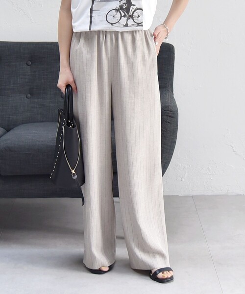 quaranciel(カランシエル)の「quaranciel:〈洗濯可能〉ストライプ イージー ワイド パンツ(セットアップ対応)(その他パンツ・レディース・ベージュ/ネイビー・36/38/40)」の1枚目の写真