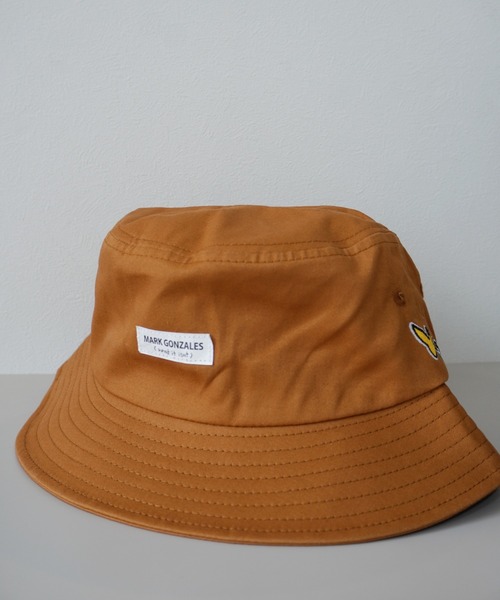 (What it isNt)ART BY MARKGONZALES(ワットイットイズント)の「【 (What it isNt)ART BY MARKGONZALES / (ワットイットイズント) アートバイ マークゴンザレス 】 コットン バケットハット(ハット・メンズ・ホワイト/ブラック/ベージュ/ブラウン/グリーン/ホワイト系その他/ブラック系その他・FREE)」の1枚目の写真