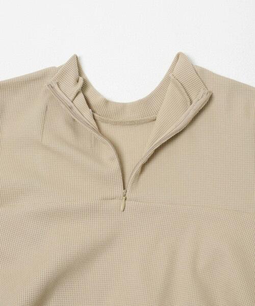 NEW BALANCE(ニューバランス)の「NEW BALANCE NB GREYペプラム長袖トップ(Tシャツ/カットソー・レディース・ベージュ/オフホワイト・MEDIUM)」の16枚目の写真