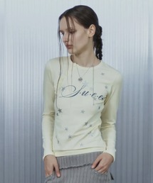 SETUPEXE（セットアップイーエックスイー）の「A'GEM/9 × .kom 『SETUPEXE/セットアップイーエックスイー』 STAR HENLEY NECK TOP/スター＆ロゴ アシンメトリーボタン長袖Tシャツ（Tシャツ/カットソー）」