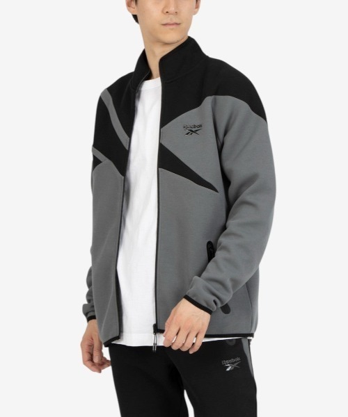 Reebok(リーボック)の「ビッグベクター ジャケット / CONTRAST PANEL FUNNELNECK JACKET(ジャージ・メンズ・アーミー/チャコールグレー×ブラック/グレー・X-LARGE/SMALL/MEDIUM/LARGE)」の2枚目の写真