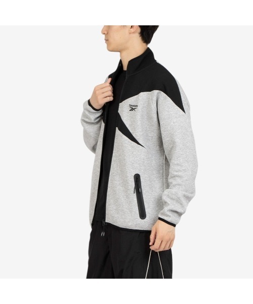 Reebok(リーボック)の「ビッグベクター ジャケット / CONTRAST PANEL FUNNELNECK JACKET(ジャージ・メンズ・アーミー/チャコールグレー×ブラック/グレー・X-LARGE/SMALL/MEDIUM/LARGE)」の4枚目の写真