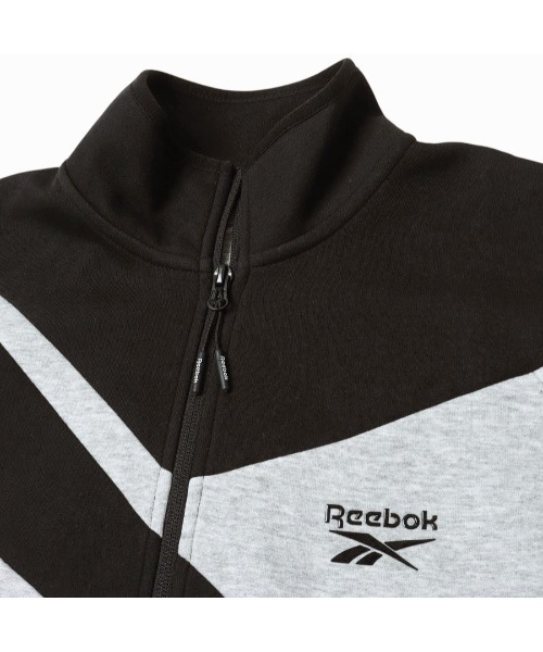 Reebok(リーボック)の「ビッグベクター ジャケット / CONTRAST PANEL FUNNELNECK JACKET(ジャージ・メンズ・アーミー/チャコールグレー×ブラック/グレー・X-LARGE/SMALL/MEDIUM/LARGE)」の7枚目の写真