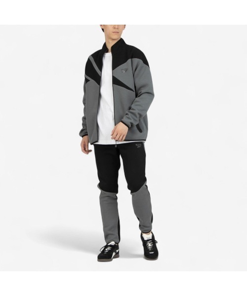 Reebok(リーボック)の「ビッグベクター ジャケット / CONTRAST PANEL FUNNELNECK JACKET(ジャージ・メンズ・アーミー/チャコールグレー×ブラック/グレー・X-LARGE/SMALL/MEDIUM/LARGE)」の18枚目の写真