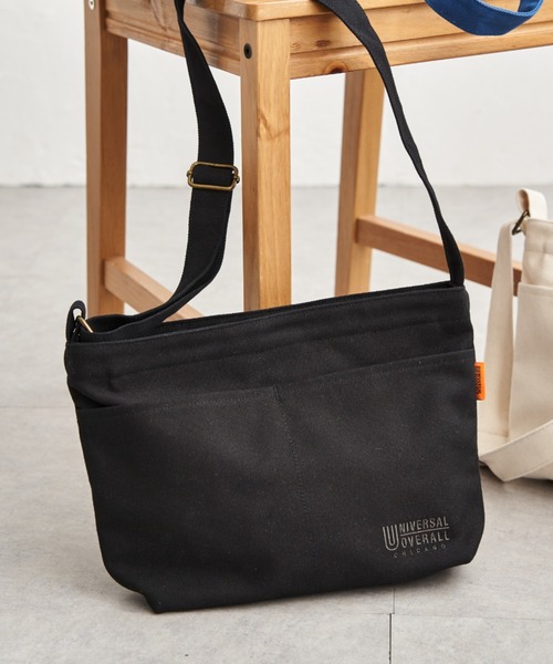 UNIVERSAL OVERALL(ユニバーサルオーバーオール)の「UNIVERSAL OVERALL ユニバーサルオーバーオール キャンバスダブルフェイスショルダーバッグ(ショルダーバッグ・メンズ・ブラック/グレー/オフホワイト/ブルー・FREE)」の1枚目の写真